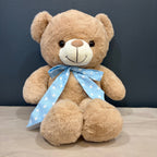 Peluche oso crema XL con cinta celeste de estrellas