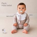 Pack Hola Bebé · Niña: el babero y el agarra chupete señalados sobre la guagua