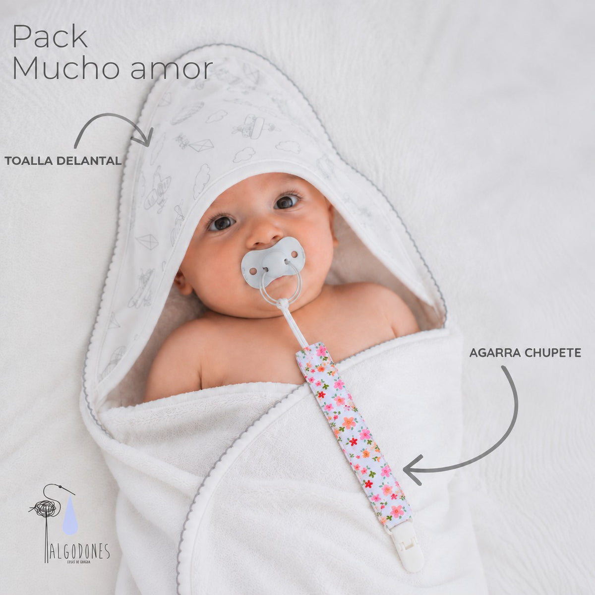 Pack Mucho Amor · Niña: la toalla delantal y el agarra chupete señalados